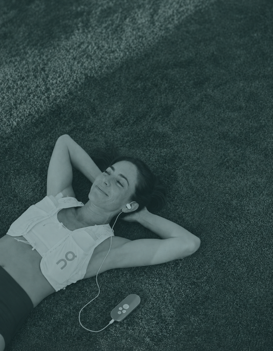 A person relaxing while using Nurosym, a vagus nerve stimulation device