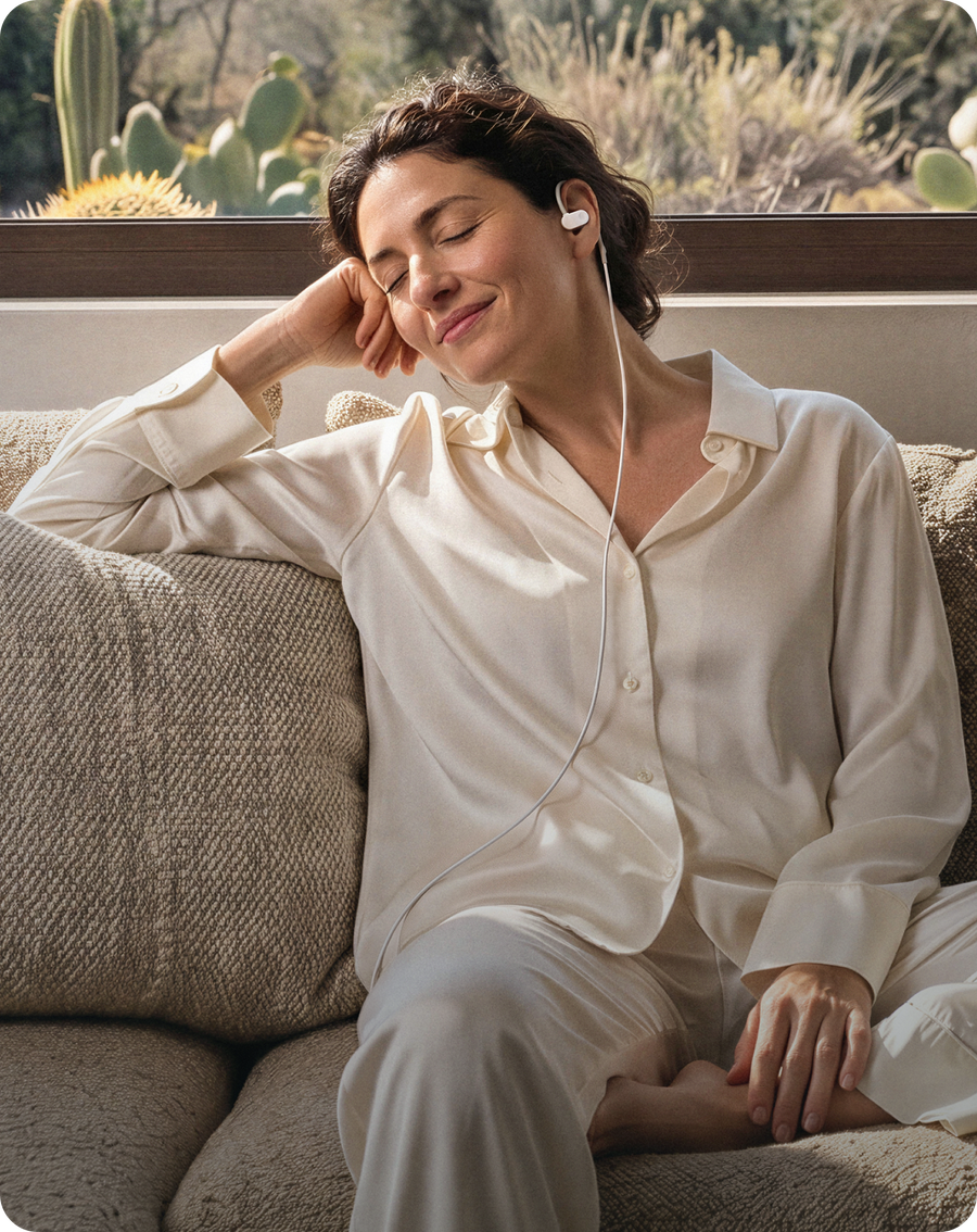 Woman relaxing on a sofa while using Nurosym